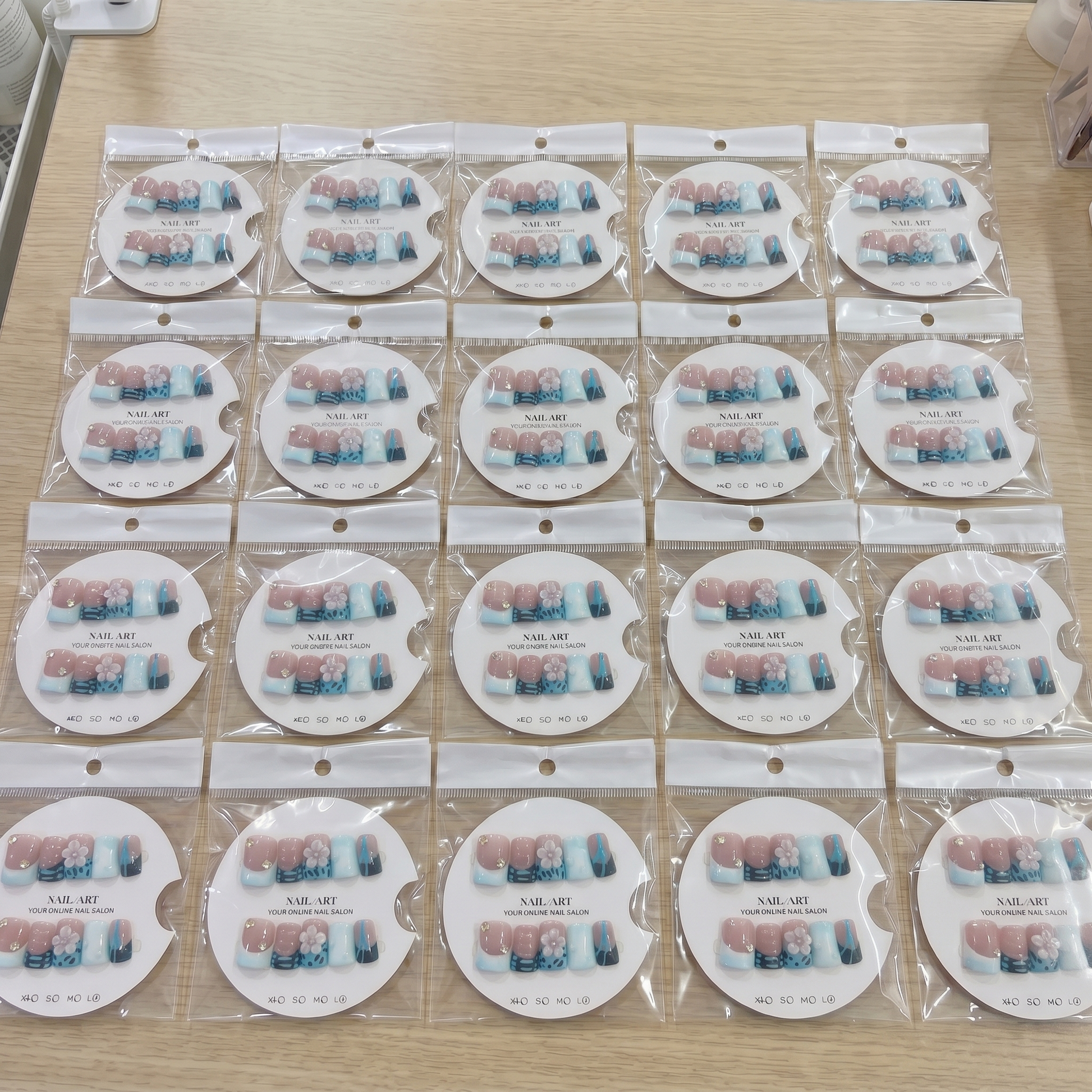 Full set of blue abstract 3D flower square press on nails displayed on size cards for custom fit.