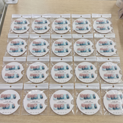 Full set of blue abstract 3D flower square press on nails displayed on size cards for custom fit.