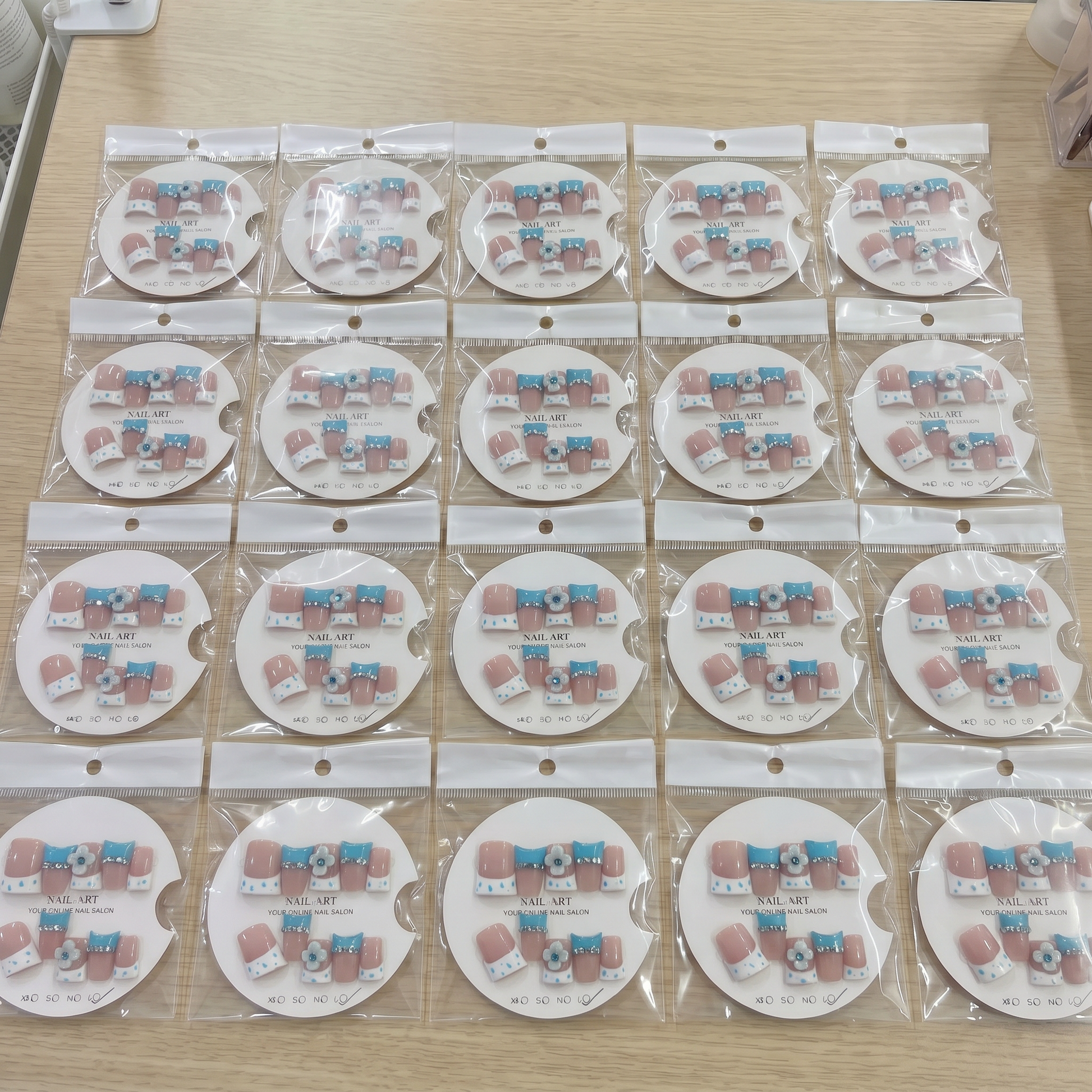 Full set of brown and blue polka dot 3D floral square press on nails displayed on size cards.