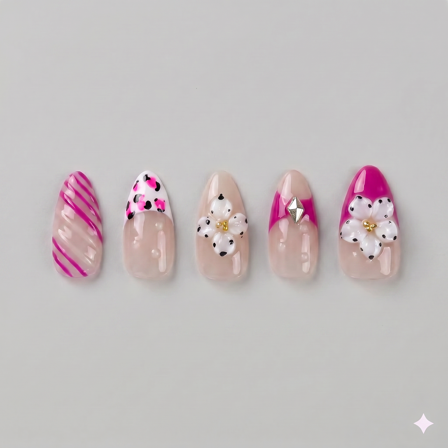 Hot pink floral almond press on nails featuring eye-catching French tips, playful swirls, and delicate white daisies with pearl centers.