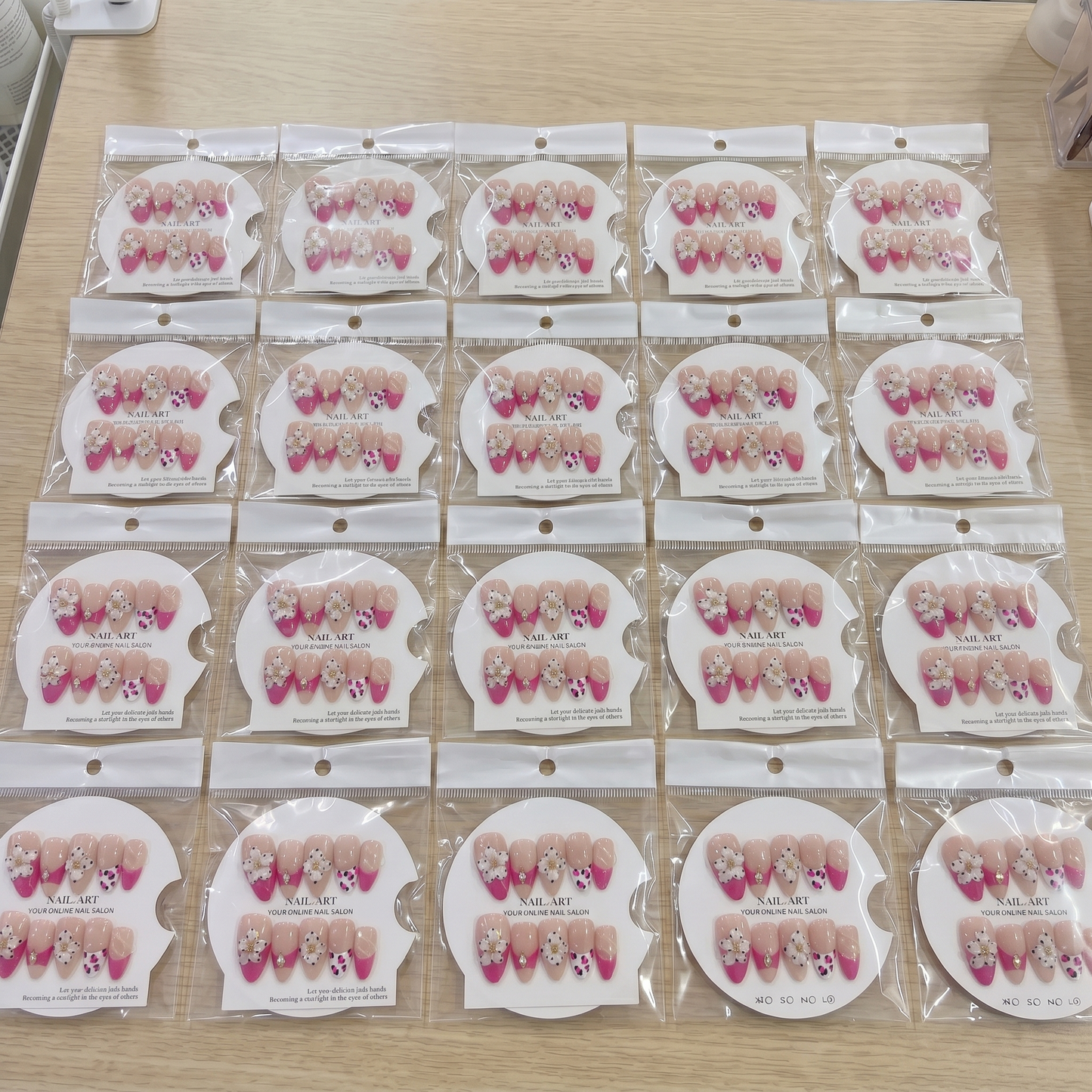 Full set of hot pink leopard 3D floral almond press on nails displayed on size cards.