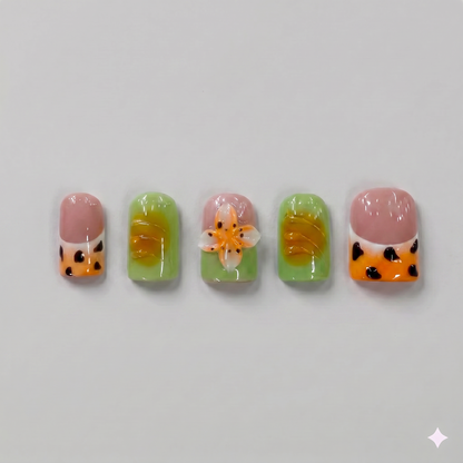 Mix and match olive green and orange leopard print square press on nails featuring a 3D orange blooming flower and wavy French tips.