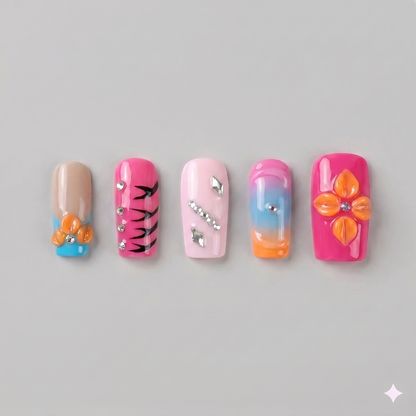 Orange and pink square press on nails featuring a 3D orange blooming flower, black zebra stripes, and sleek silver chrome stars.
