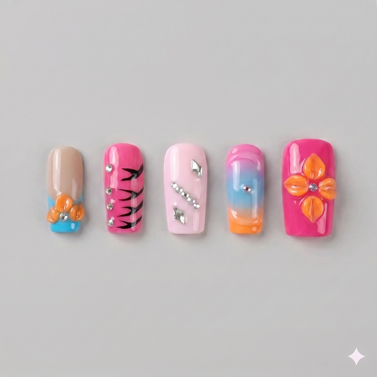 Orange and pink square press on nails featuring a 3D orange blooming flower, black zebra stripes, and sleek silver chrome stars.