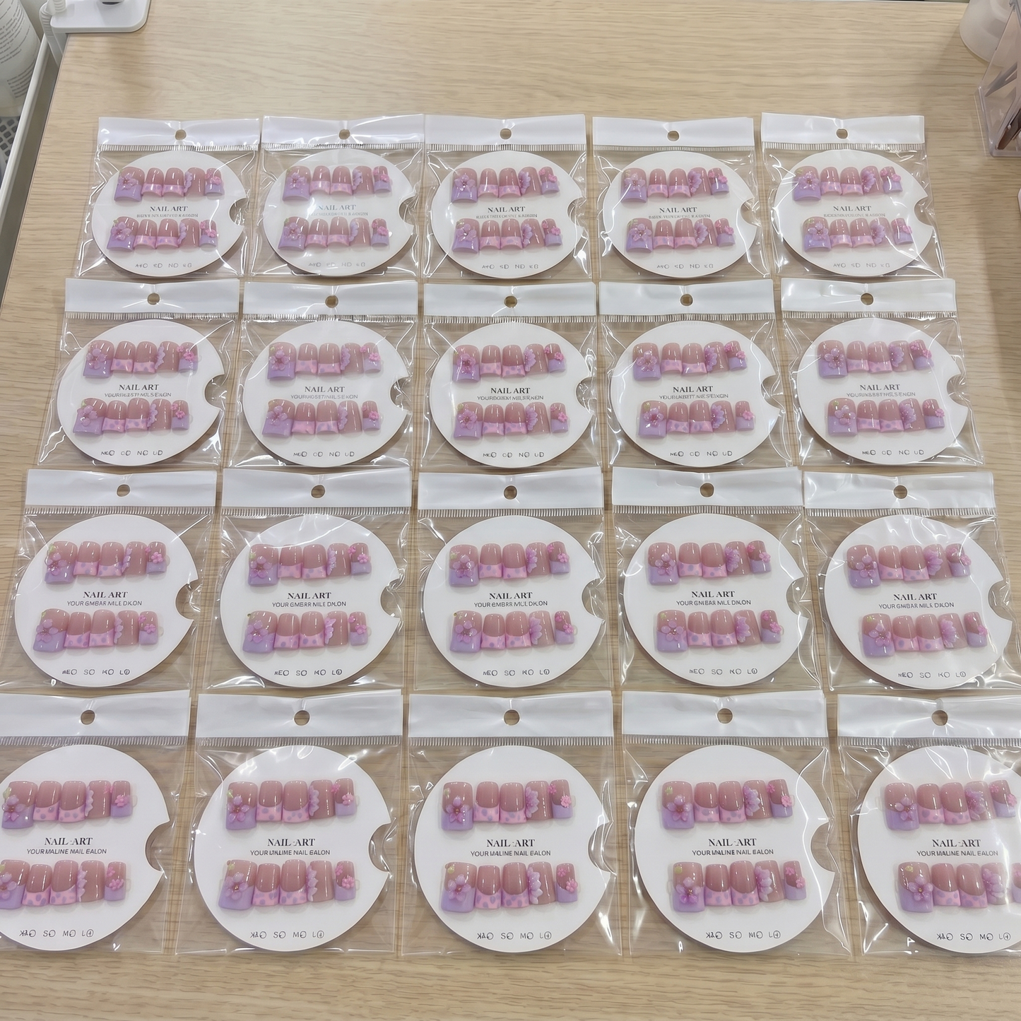 Full set of pink aura 3D floral square press on nails displayed on size cards.