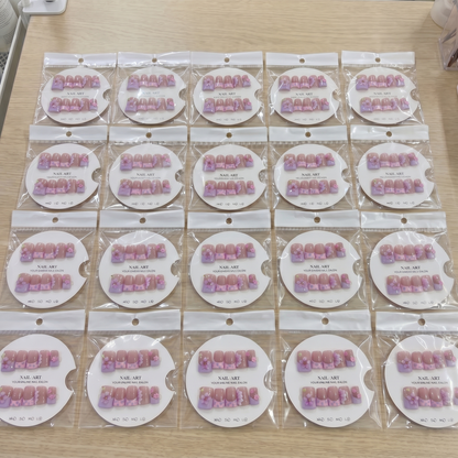 Full set of pink aura 3D floral square press on nails displayed on size cards.