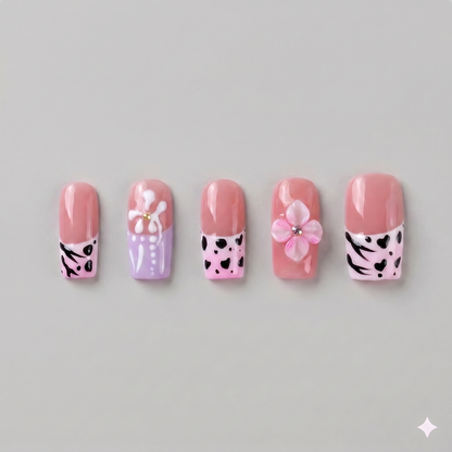 Pink leopard print square press on nails featuring a 3D pink blooming flower, black animal print spots, and French tips.