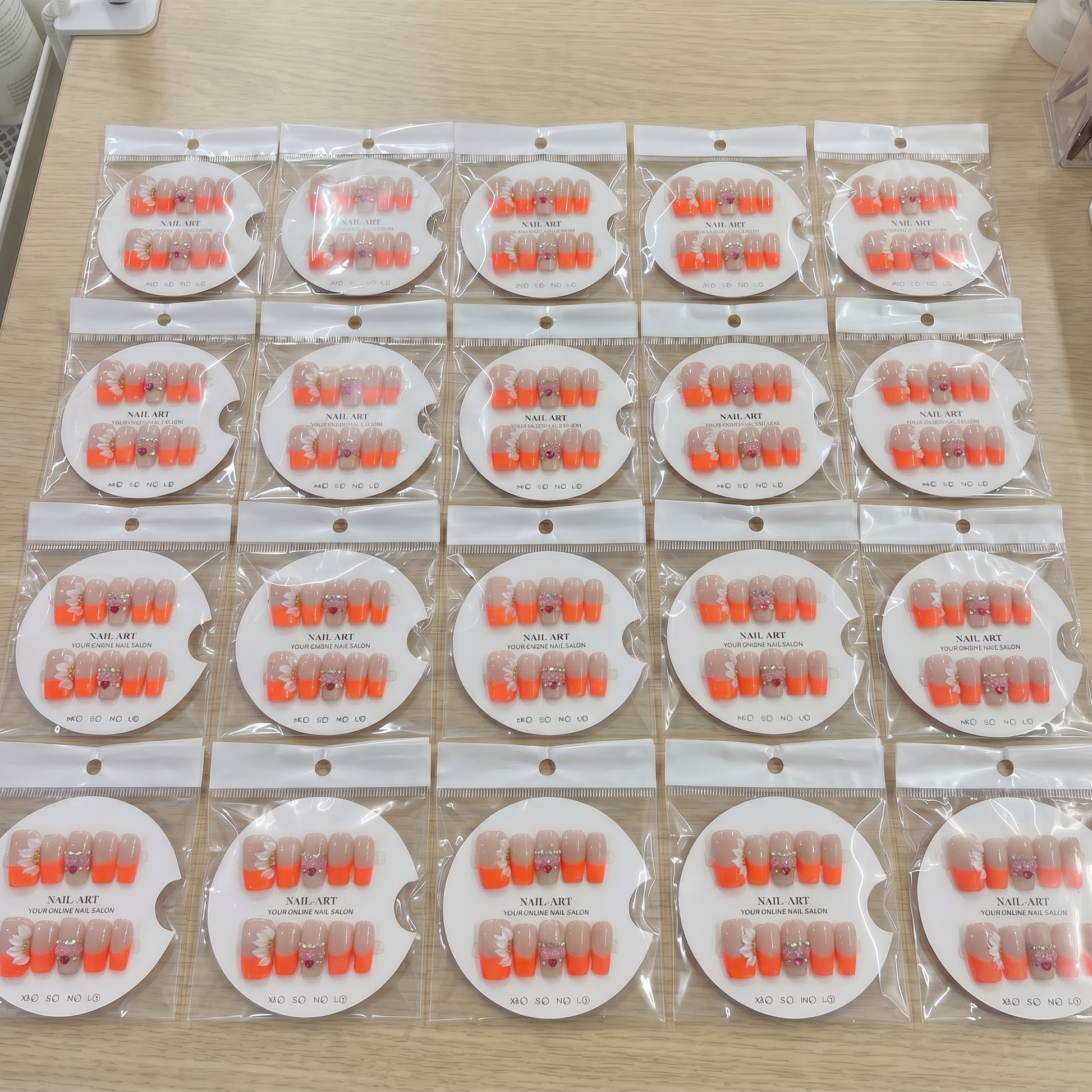 Full set of vibrant orange French tip 3D floral square press on nails displayed on size cards.