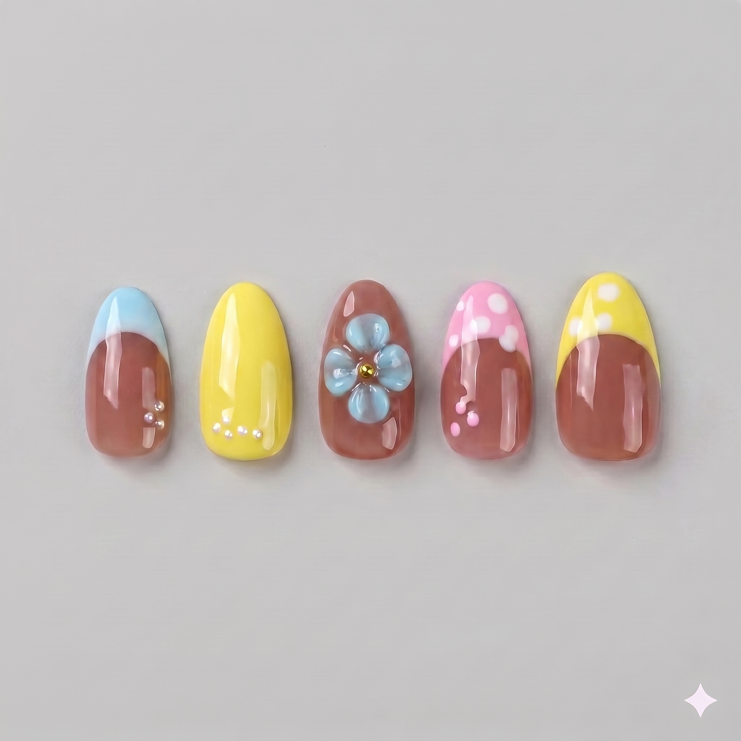 Retro yellow French tip almond press on nails featuring delicate white polka dots and a statement 3D baby blue blooming flower.