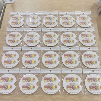 Full set of retro yellow 3D floral almond press on nails displayed on size cards.