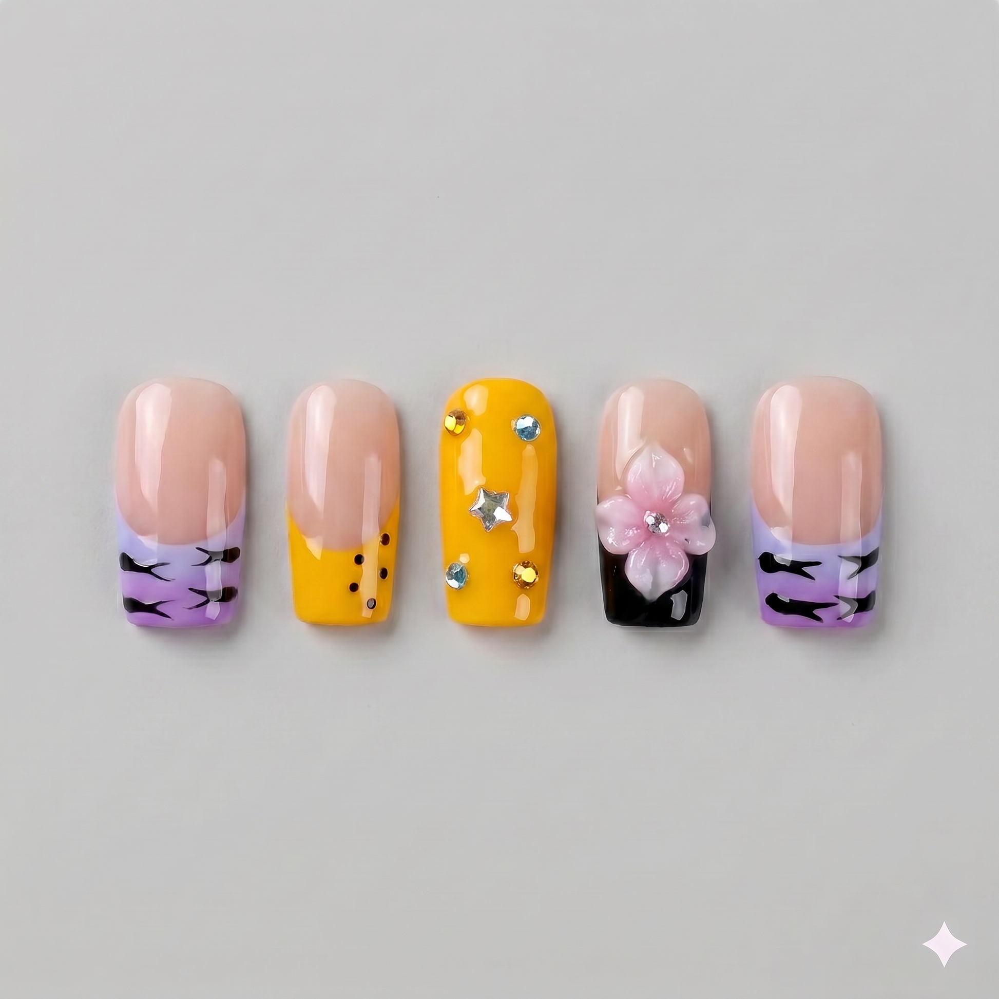 Mix and match yellow and zebra print square press on nails featuring a 3D pink blooming flower and silver star gems.