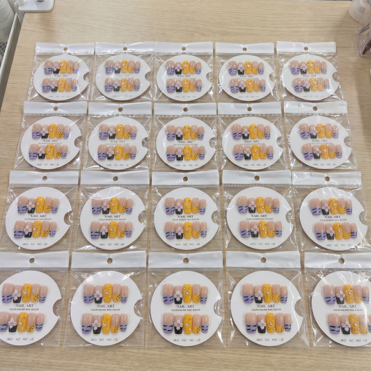 Full set of yellow and zebra mix and match 3D floral square press on nails displayed on size cards.